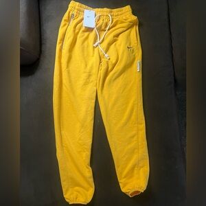 NWT - Nike women’s XS yellow dri-fit loose fit sweatpants